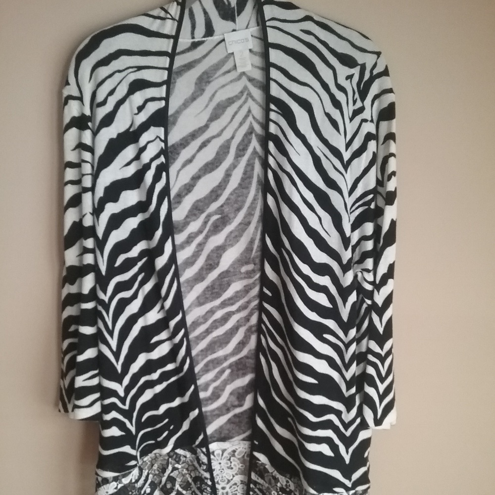 Zebra striped top/tunic with cut-work hemline.
